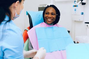 patient at dentist smiling dental anxiety treatment